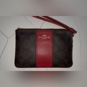 Coach corner zip canvas wristlet.